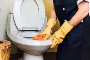 Plumber fixing drain odor issue in Calgary