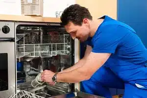 Calgary technician performing dishwasher maintenance