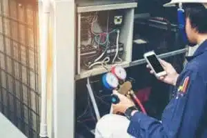 Technician performing furnace maintenance in Calgary