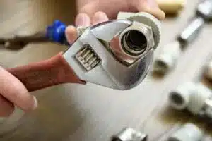 Technicians fixing leaking pipes in a Calgary home