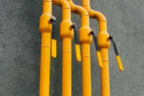 Technician installing a residential gas line in Calgary
