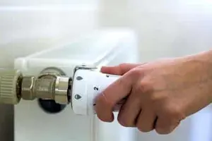 Calgary technician installing a modern thermostat
