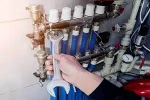 Calgary plumber installing water heater in a residential home