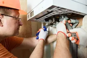 Emergency tankless water heater repair by Calgary plumber