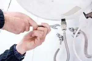 Technician providing urgent water heater installation in Calgary