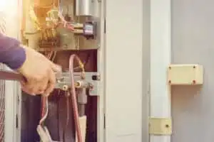 Heating expert checking furnace for safety and efficiency