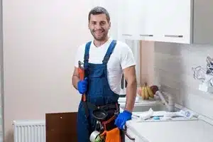 Calgary technician cleaning garburator system
