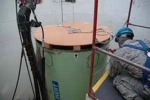 Technician testing sump pump float switch