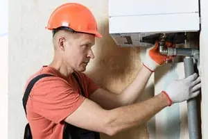 Wall-mounted tankless water heater installed in Calgary