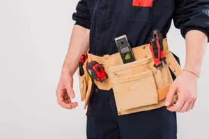 User setting a programmable thermostat in Calgary