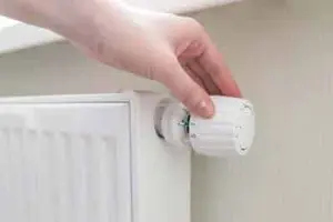 Smart thermostat app displayed on phone in Calgary