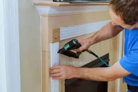 Technician performing gas fireplace repair in Calgary