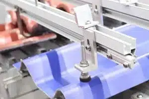 HVAC technician measuring and fitting sheet metal ducts