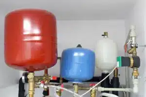 Ray-Z Plumbing technician installing expansion tank in Calgary