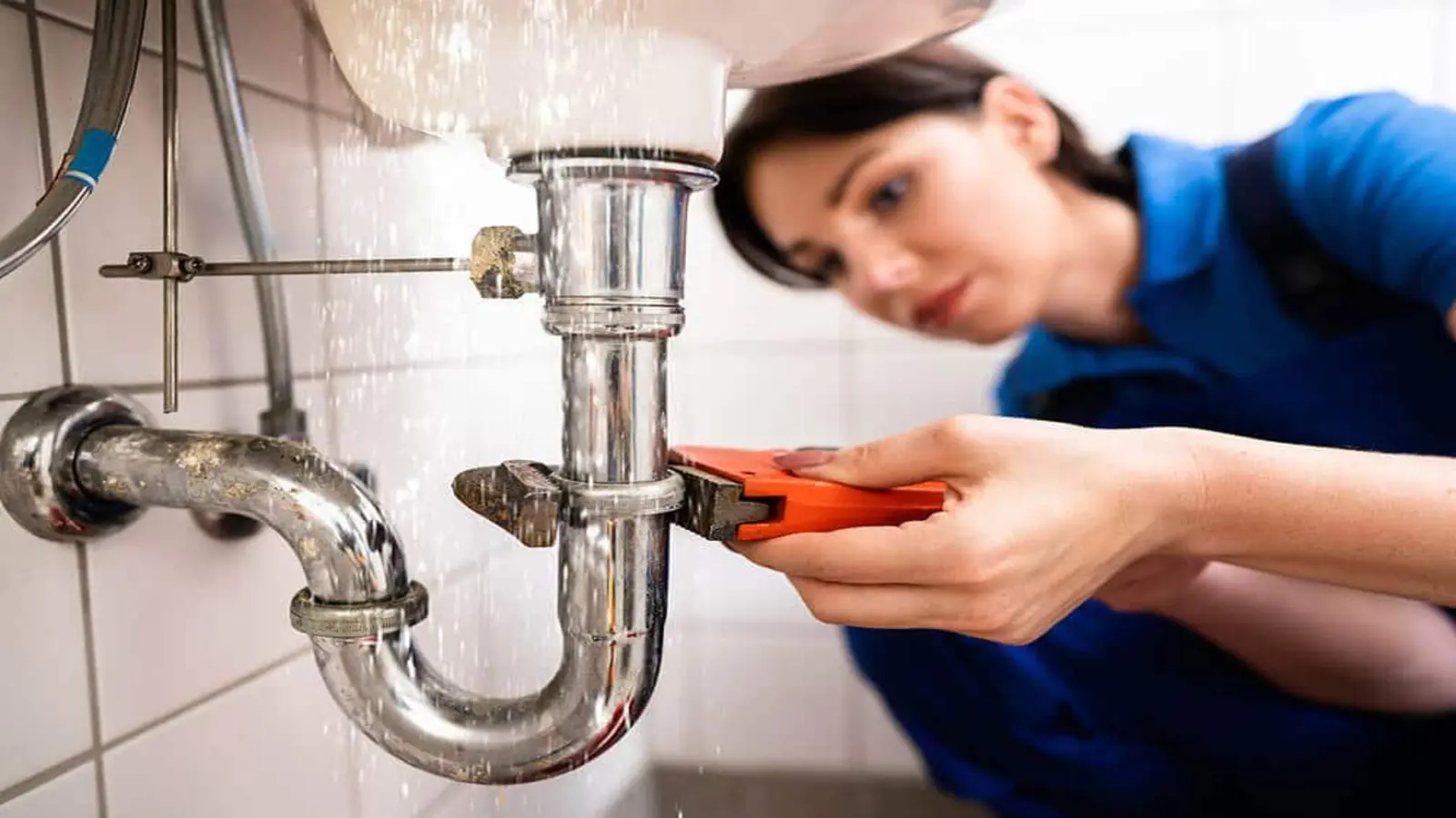 Ray-Z Plumbing technician fixing drainage system in Calgary