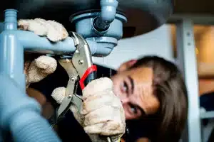 Calgary plumber replacing water pipes in a home