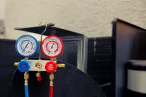 Furnace technician adjusting gas valve in Calgary