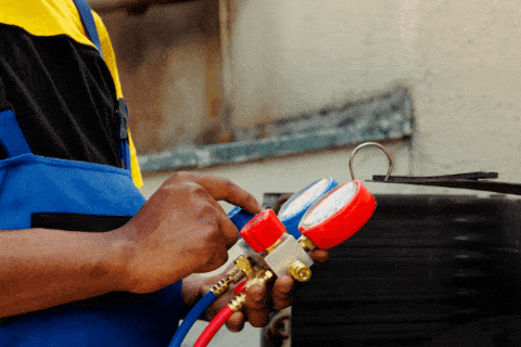 Close-up of AC refrigerant lines during repair service