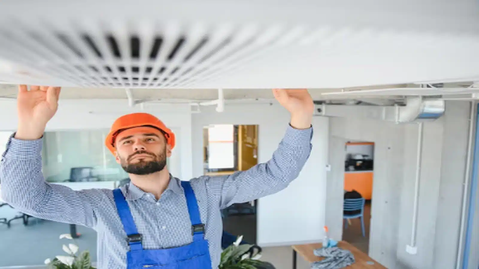 Technician installing ventilation in Calgary
