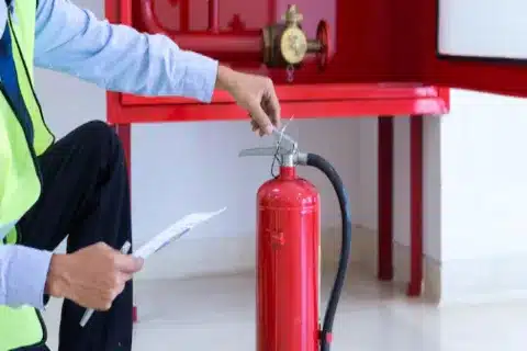 Calgary fire safety expert refilling an extinguisher